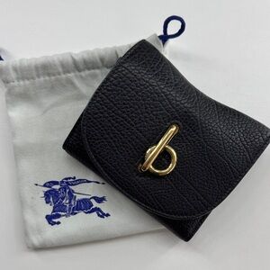 Burberry Rocking Horse textured-leather wallet with a gold-tone clasp.
